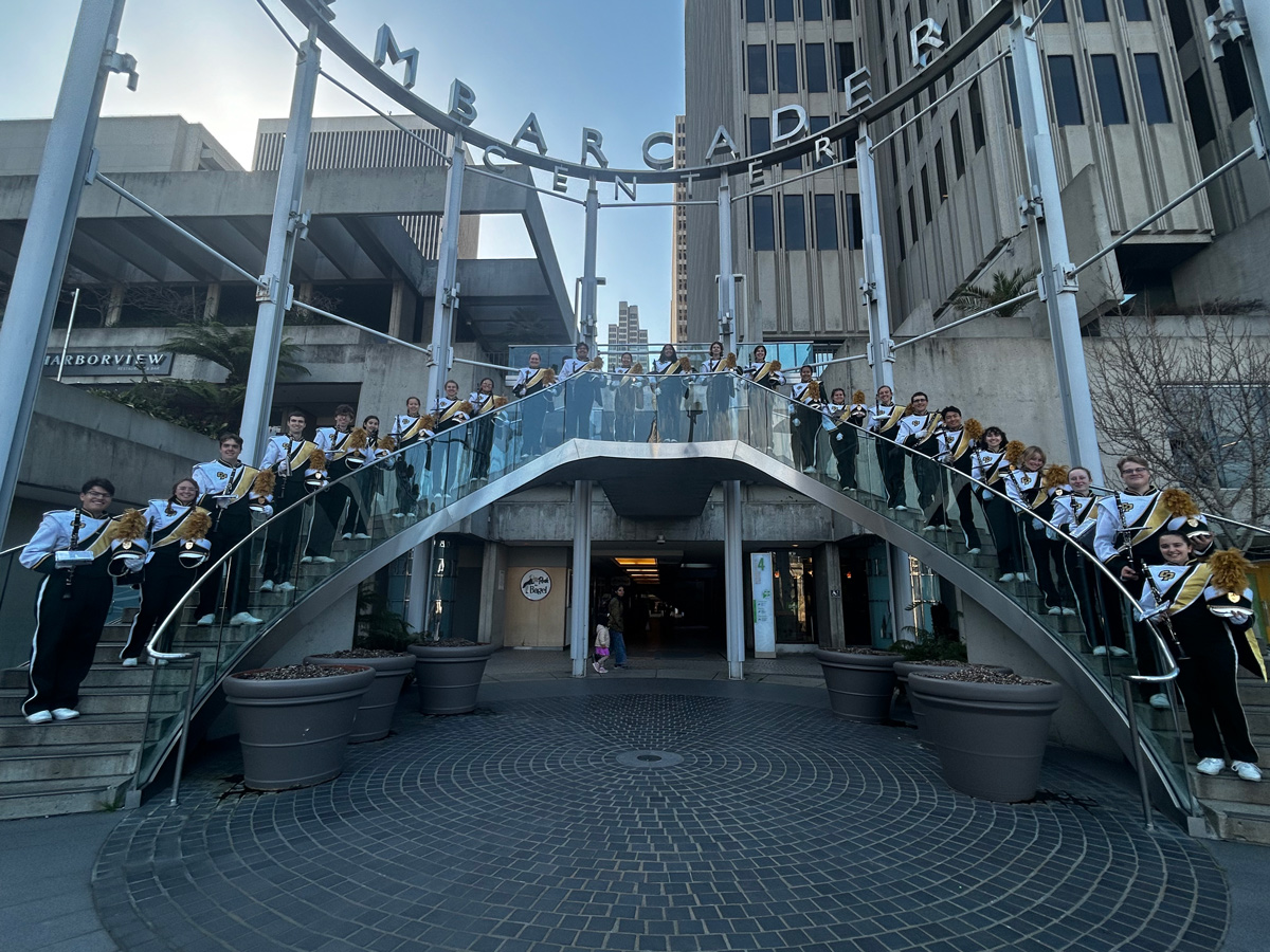 Mustang Band's 26-member clarinet section posed for a photo in uniforms on the steps of the Embarcadero Center in San Francisco.