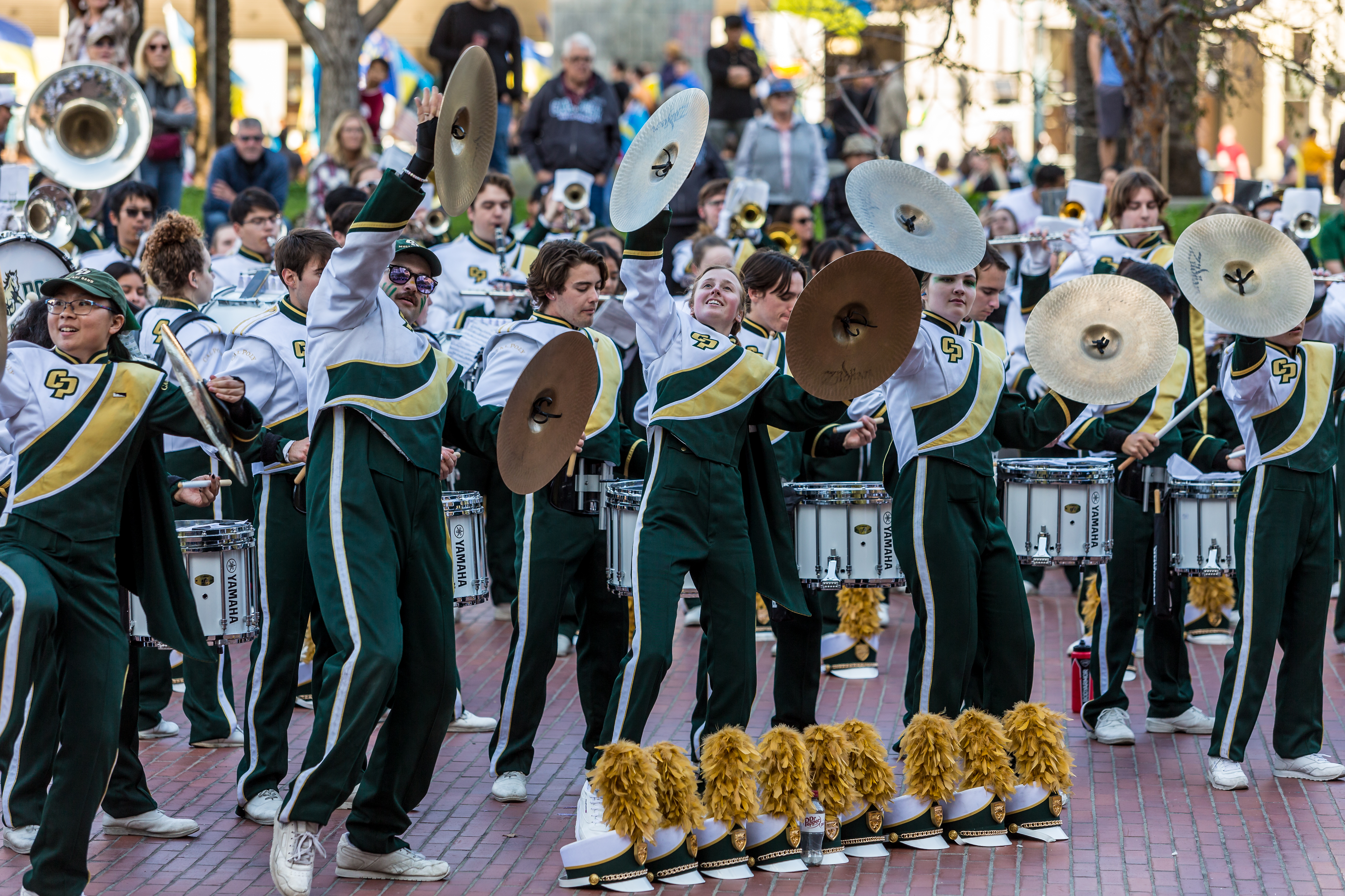 Mustang Band's cymbal players perform in front of the San Francisco Ferry building ahead of the Chinese New Year Parade.